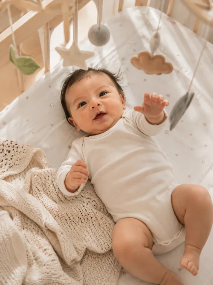 Reel Life sample photo of a baby in a nursery cot.